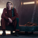 Jodie Whittaker's 13th Doctor wearing alien prison clothes and locked in an isolated cell.